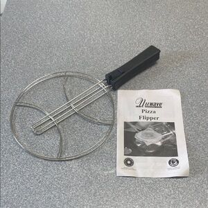 Silver and Black Pizza Flipper Kitchen Tool